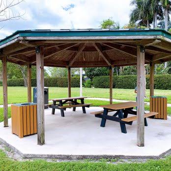 Covered picnic shelter with tables at Sunny Lake Bird Sanctuary in Davie, Florida.